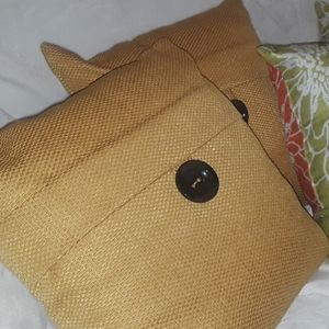 Two mustard pillows